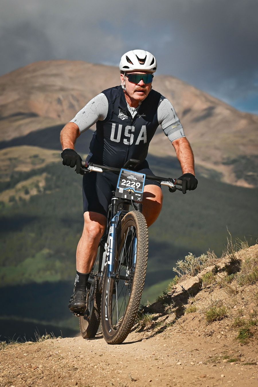 Climbing on the Leadville course in USA Cycling Foundation kit
