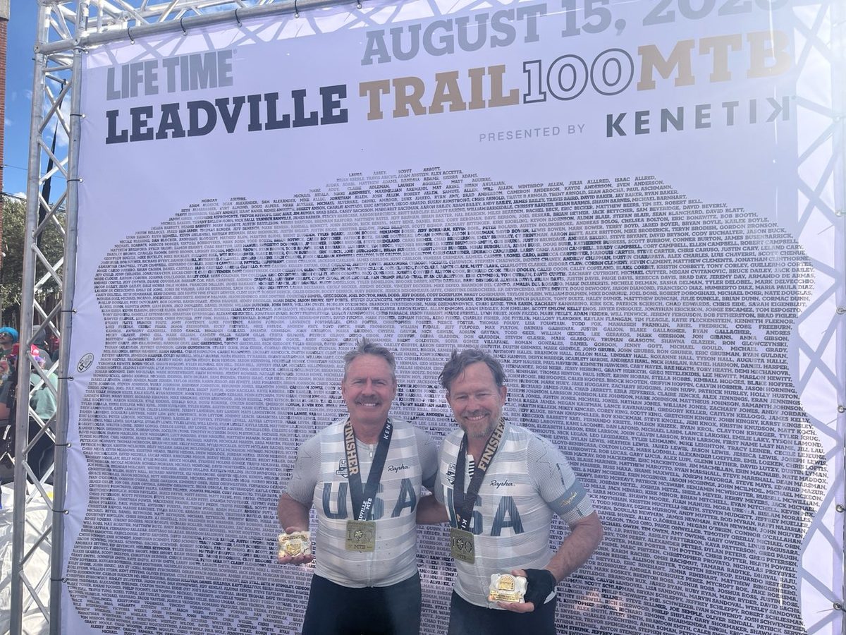 Eric Skalski and Michael Roshon with their finisher medals and buckles